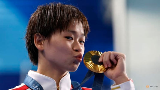 Chinese diver Quan Hongchan's thoughts turn to food after winning 10m platform gold