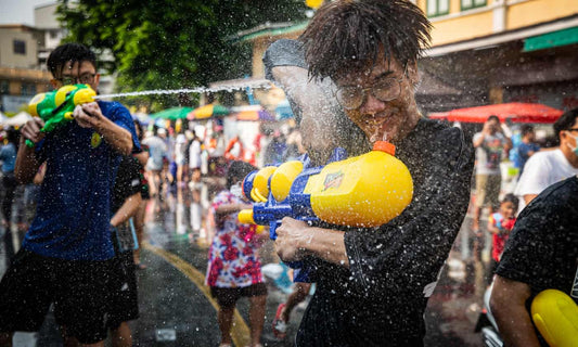 ‘You’re going to get wet’: revellers soak up Thailand’s first post-pandemic Songkran water festival